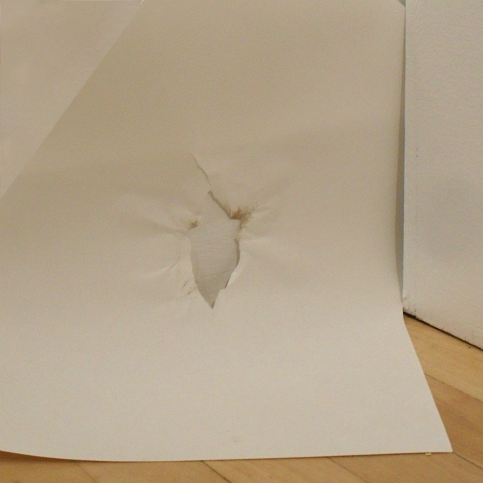 <b>The Art of War</b> (detail)<br>
Rocks, sheets of paper, and scissors.<br>
Dimensions variable<br>
2010